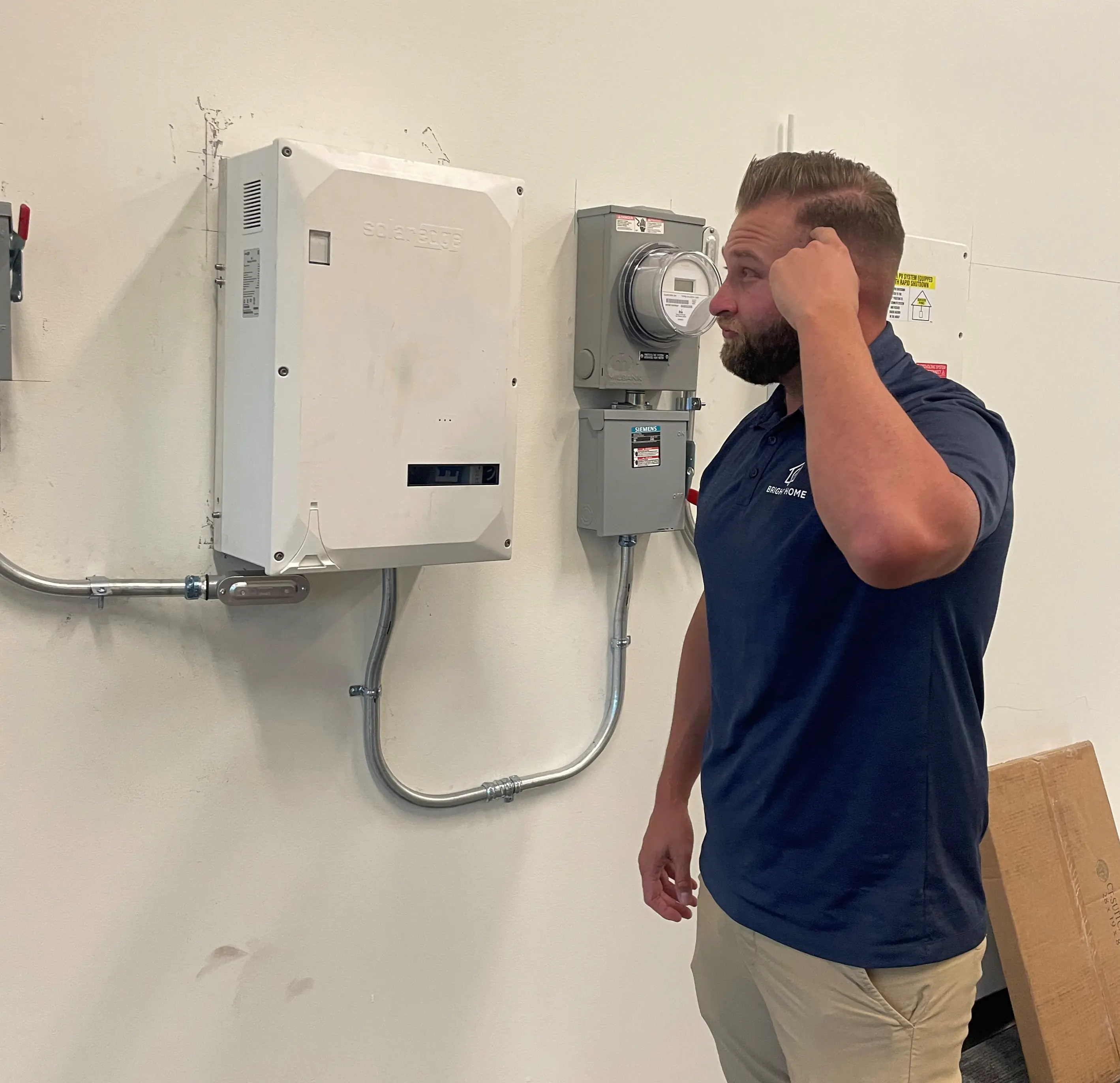 Inspector reviewing installed solar equipment