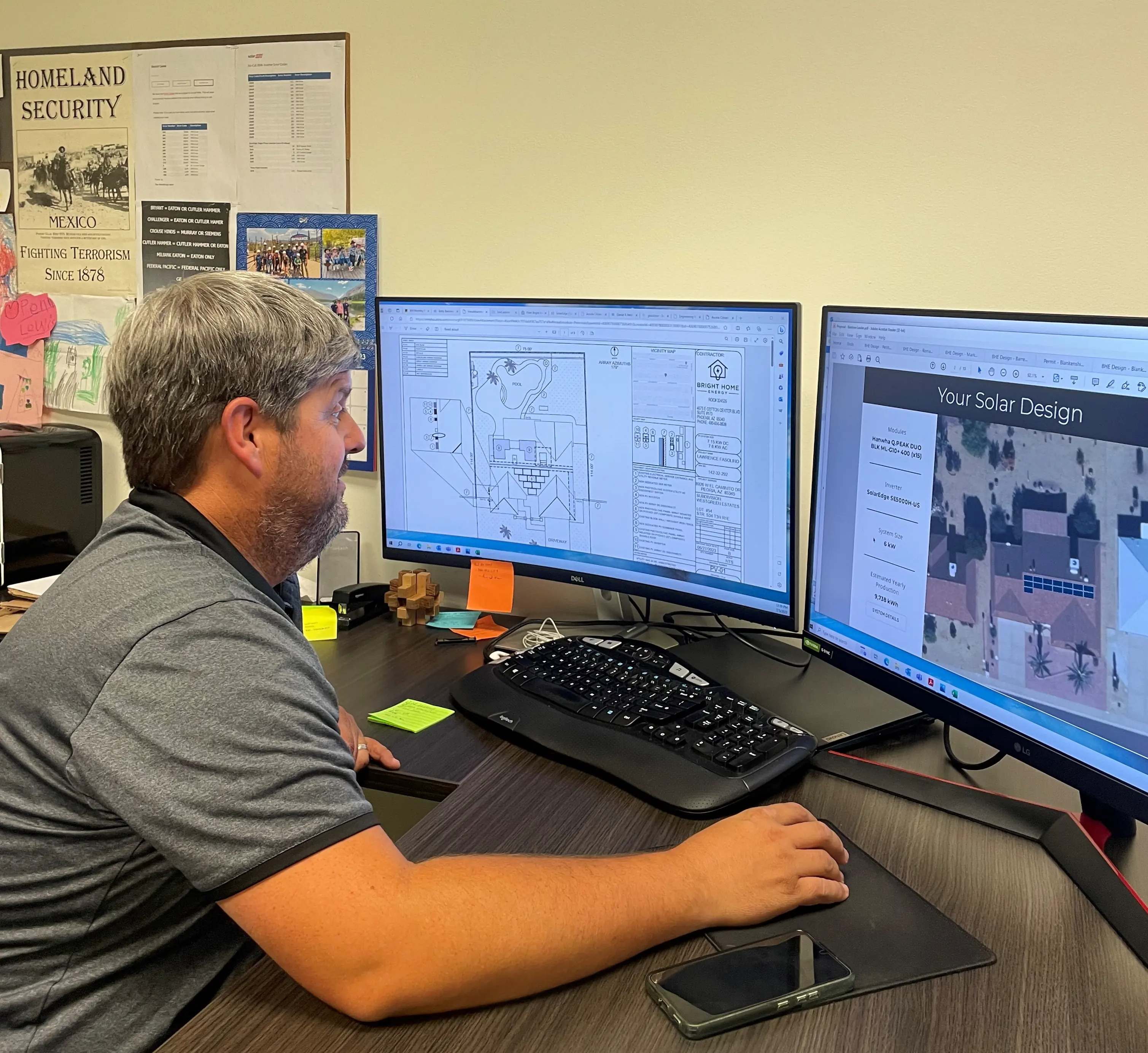 Team member reviewing and approving final solar design