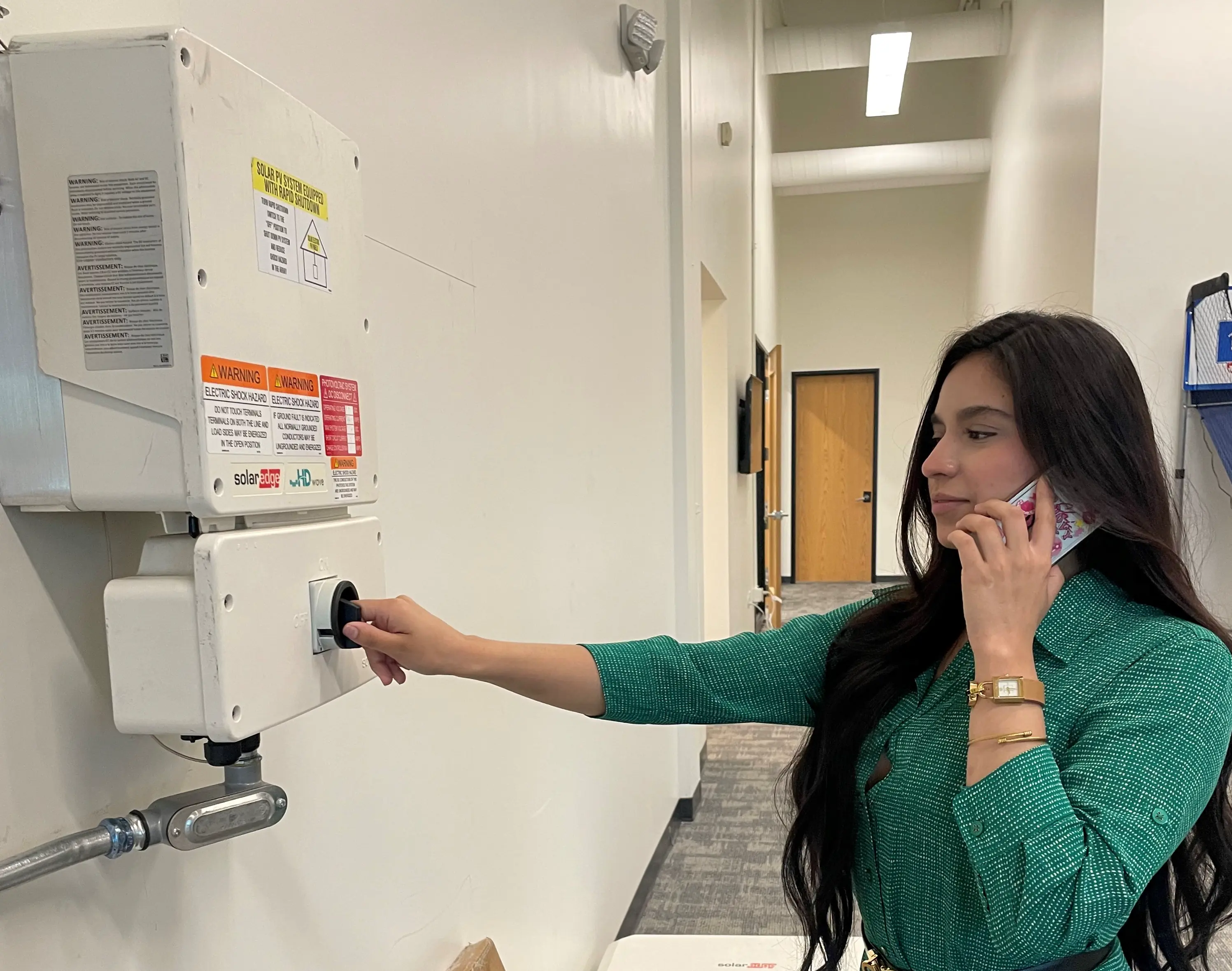 Homeowner switching on system during commissioning call